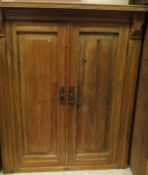 A 19th Century pine two door cupboard together with a pine wall hanging corner cabinet