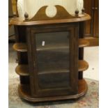 A mahogany wall hanging single glazed door cabinet