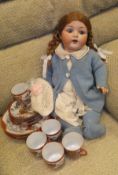An Armand Marseille Bisque headed doll with composition body, arms and legs,