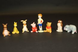 A Beswick Walt Disney Products "Christopher Robbin / Winnie the Pooh" set comprising Christopher