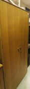 A Meredew two door oak wardrobe together with a white painted rocking chair and two mahogany cane