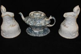 A pair of Victorian relief work jugs decorated with pairs of exotic dolphins and tridents,