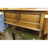 An oak lift top trunk with panelled sides to turned legs CONDITION REPORTS Size