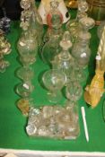 A collection of glassware comprising nine various decanters, various wine and liqueur glasses,