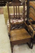 A 19th Century mahogany rocking chair with single drawer to the seat