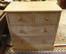 A stripped pine chest with two short over two long drawers by Heal & Son of London
