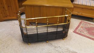 A brass and wire fire spark guard with brass gallery to the top,