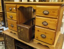 An oak pedestal six drawer desk, a pine desk of six drawers, an oak gateleg dining table,