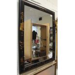 A rectangular wall mirror with a black ground chinoiserie style frame