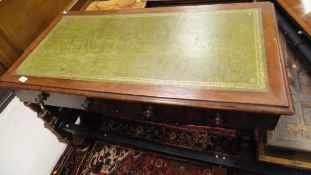 A mahogany side table with green leather inset top above two drawers,