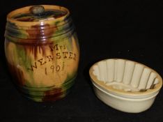 A late Victorian glazed pottery barrel shaped jar and cover inscribed "Mrs Webster 1901",