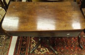 A mahogany folding tea table on single turned column to four cabriole legs,