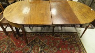A 19th Century mahogany D-end extending dining table to square section tapering legs