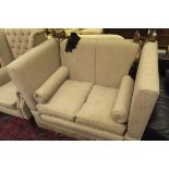 A knoll type two seat sofa and wingback armchair in oatmeal upholstery