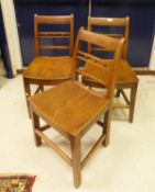A set of six 19th Century Norfolk style elm seated dining chairs on square section tapering legs
