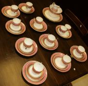 A Minton style pink and gilt decorated part tea set comprising cream jug, slop bowl,