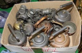 A collection of miniature copper kettles, pewter inkwells, tankards,