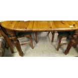 A pine D-end extending dining table and four chairs