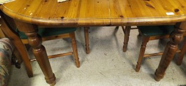 A pine D-end extending dining table and four chairs
