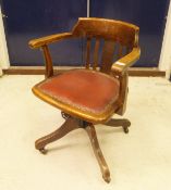 An early 20th Century oak office swivel chair stamped "W.A.