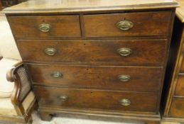 A 19th Century oak chest of two short and three long graduated drawers to bracket feet