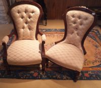 A pair of Victorian walnut framed ladies and gents salon chairs