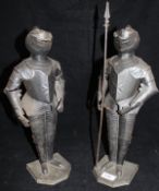 A pair of miniature patinated tin suits of armour,