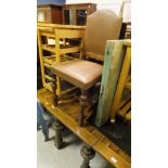 An oak drop leaf table together with oak and leather seated dining chairs,