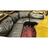 A black leather corner sofa suite