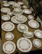 A Royal Doulton "Rosell" (H4976) part dinner service, comprising ten dinner plates, ten side plates,