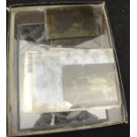 A box containing various glass plate negatives,