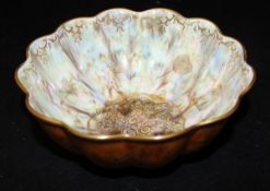 A Wedgwood lustre ware bowl of scallop design, the exterior decorated with various butterflies,