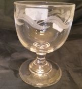 A circa 1800 drinking glass decorated with thistles,