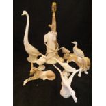 A collection of five various Lladro figures including Bassett hound, donkey, two geese and a swan,