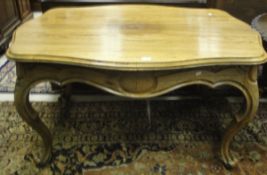 A French rosewood centre table on cabriole legs and scrolled feet