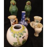 A selection of various Chinese porcelain and pottery including two green glazed parrot figures,