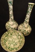 A pair of Chinese famille-verte prunus blossom decorated onion-shaped vases and matching fruit bowl