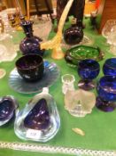 A collection of glassware to include an amethyst finger bowl, a studio glass green bowl,