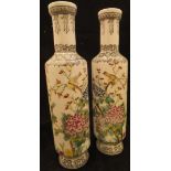 A pair of Chinese polychrome decorated vases of slender form,