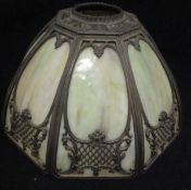 A Tiffany style lampshade with opalescent pink and green ground glass and cast metal frame