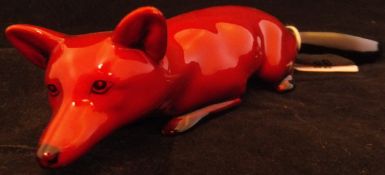 A Royal Doulton Flambé figure of a crouching fox CONDITION REPORTS Fox with some