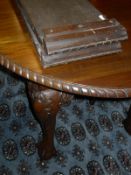 A mahogany D end dining extending table on cabriole legs to claw and ball feet