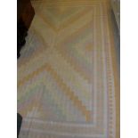 A Kilim rug, the central panel set with a chevron design in pastel colours,