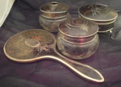 A collection of silver mounted tortoiseshell dressing table items to include two scent bottles,