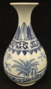 A Chinese blue and white gourd shaped vase decorated with garden and fence pattern,