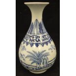 A Chinese blue and white gourd shaped vase decorated with garden and fence pattern,