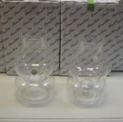 A collection of four Princess House crystal hurricane lamps (boxed) and a vintage wooden stepladder