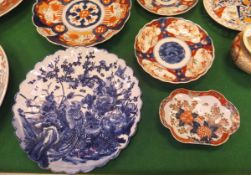 A collection of Japanese Imari wares including three vases, one with lid, three various plates,