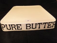 An early 20th Century Parnell & Sons Ltd "Pure Butter", shop display dish in cream glazed pottery,