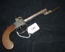 A 19th Century hammer action travelling pistol, the straight grain walnut stock of curved design,